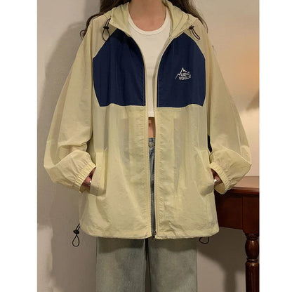 Women's summer sun protection top with raglan sleeves in apricot colour showing loose fit and splicing details