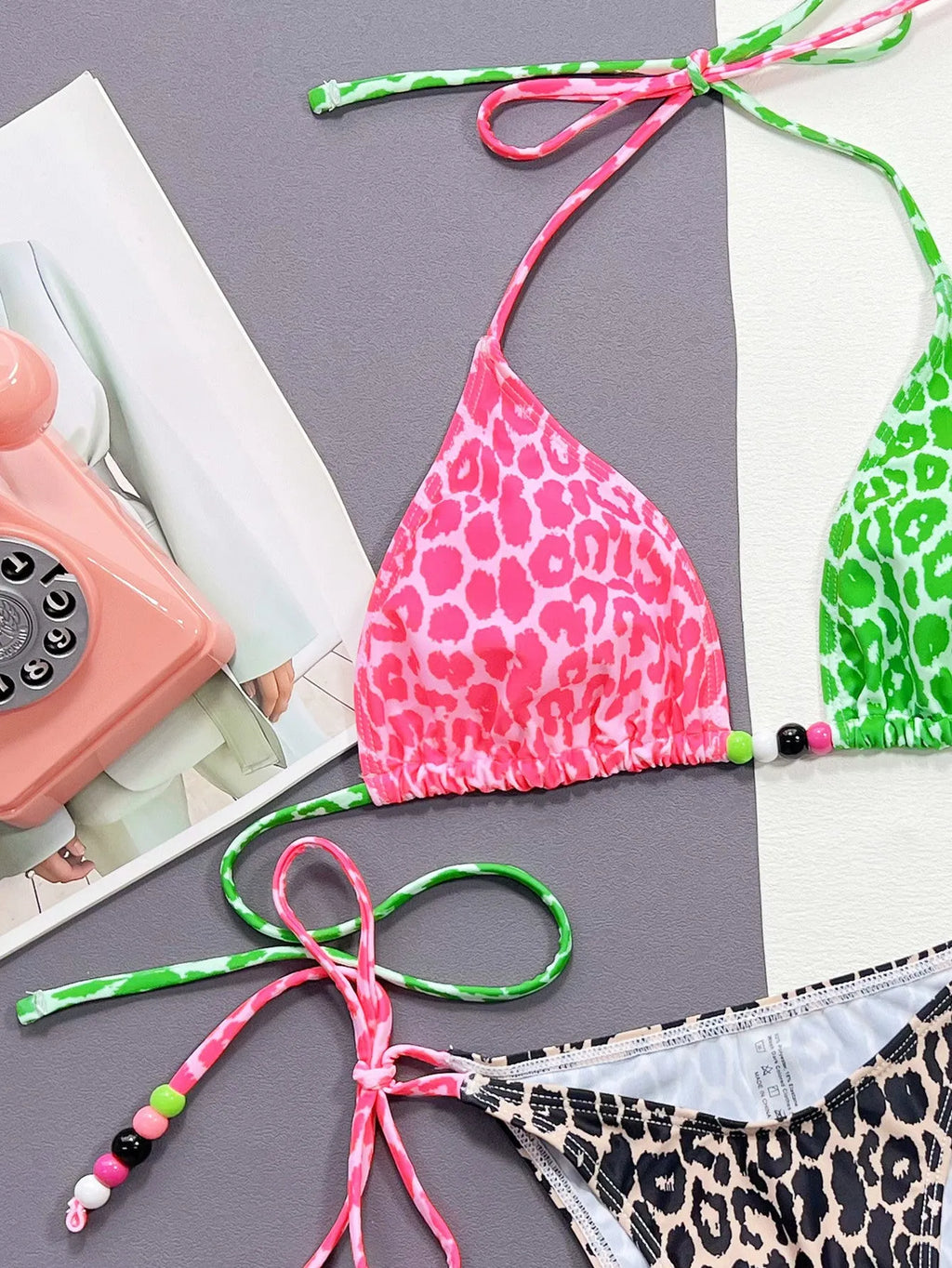 Women's leopard print bikini swimsuit with split-style briefs showing bra and matching briefs