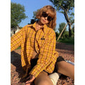 Dopamine yellow American plaid shirt with loose fit on hanger.