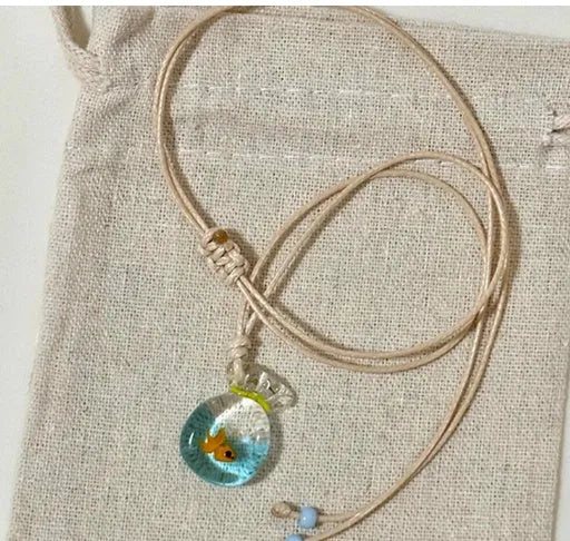 Women's skirt-shaped joker pendant necklace on a cotton and linen clavicle chain.