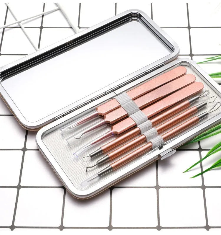 Six rose gold stainless steel acne removal tools arranged on a clean surface