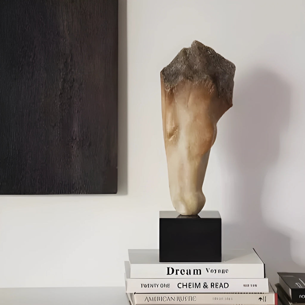 Abstract bronze horse head desktop sculpture with carved texture on a wooden table.