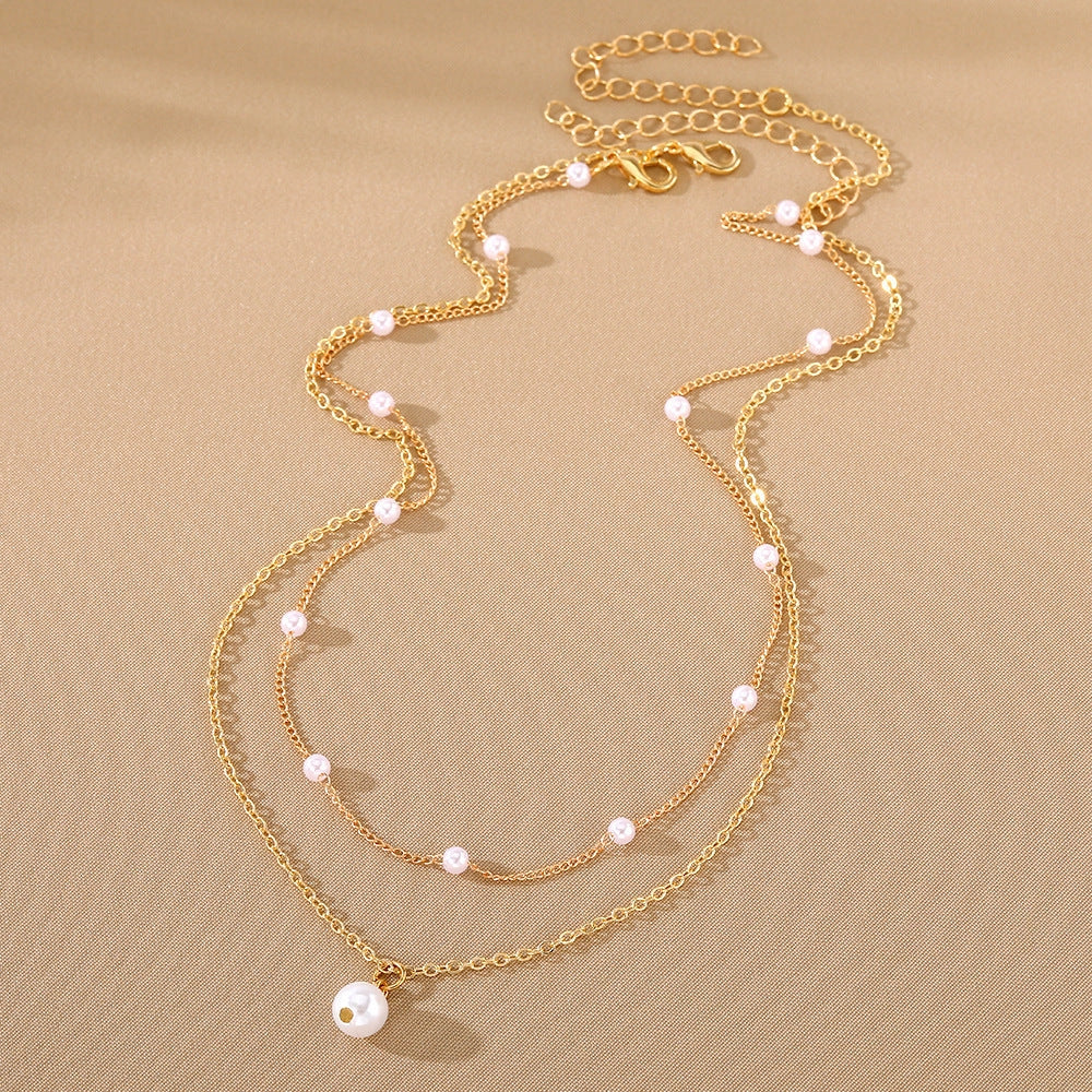 Women's gold double-layer pearl tassel necklace with O-ring chain