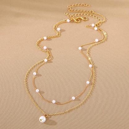 Women's gold double-layer pearl tassel necklace with O-ring chain