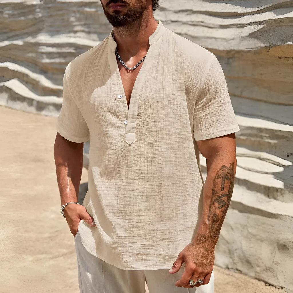 Men's solid colour short-sleeved shirt with a stand collar on a hanger.