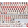 Close-up of a pink PBT key cap with a detailed Fragrant Pig design, showing five-sided sublimation printing.