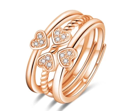 Adjustable four-leaf clover ring with spinning top design and zircon accents