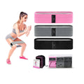 Set of three fabric resistance bands in lake blue, pink, and purple with a mesh storage bag.