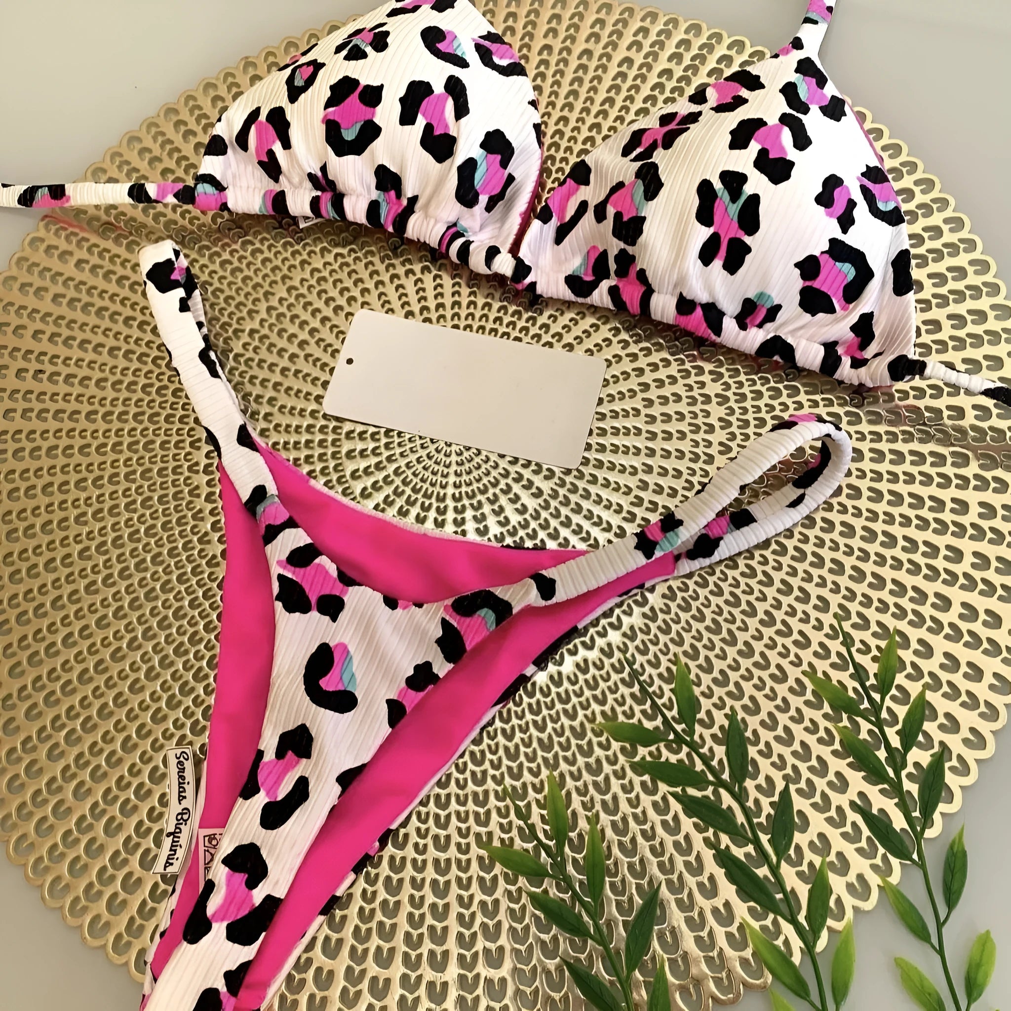 Women's printed bikini swimsuit with briefs style on a mannequin, showing the cotton lining and high elasticity fabric.