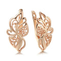 Women's rose gold earrings with hollow carved geometric design and rhinestone accents