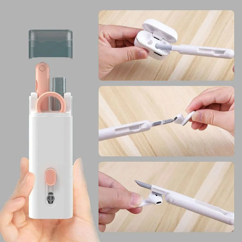 Multifunctional electronics cleaning kit with cleaning pen, brush, key puller, and spray bottle on a white background