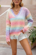 Pink rainbow gradient loose knit sweater with tassel details on hanger