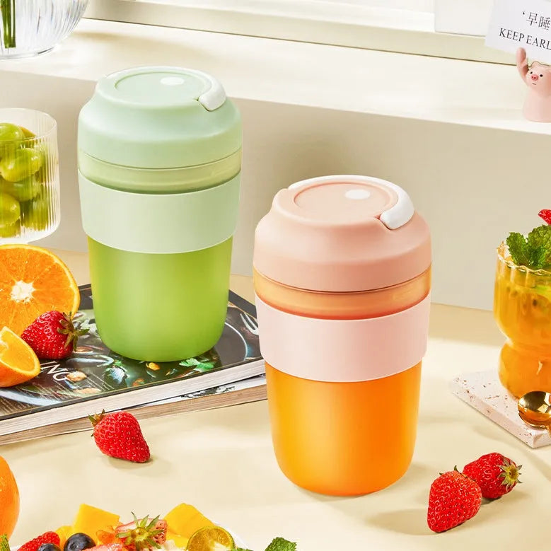 Grape purple portable blender cup with four stainless steel blades and USB charging cable.