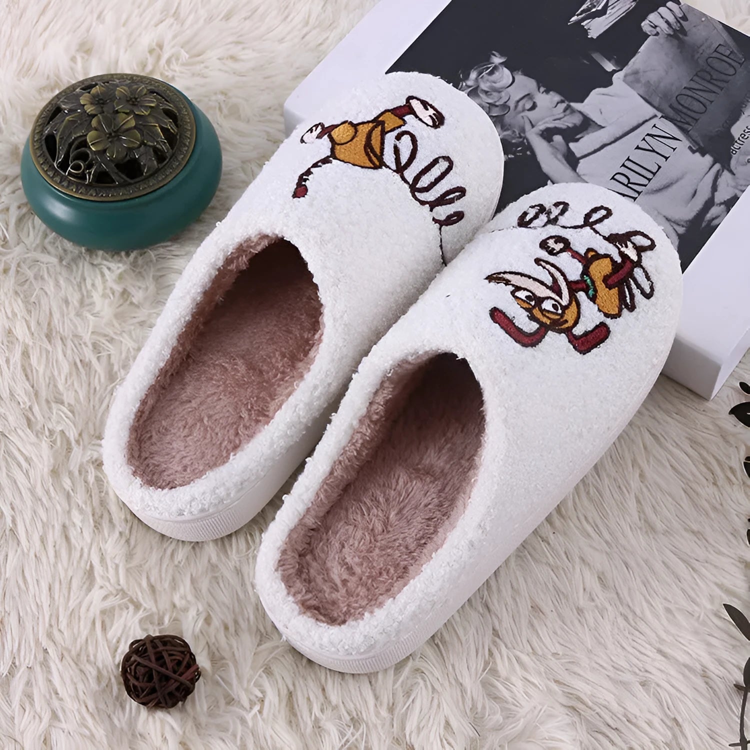 White cartoon pattern fluffy slippers with a plush upper and a non-slip rubber sole.