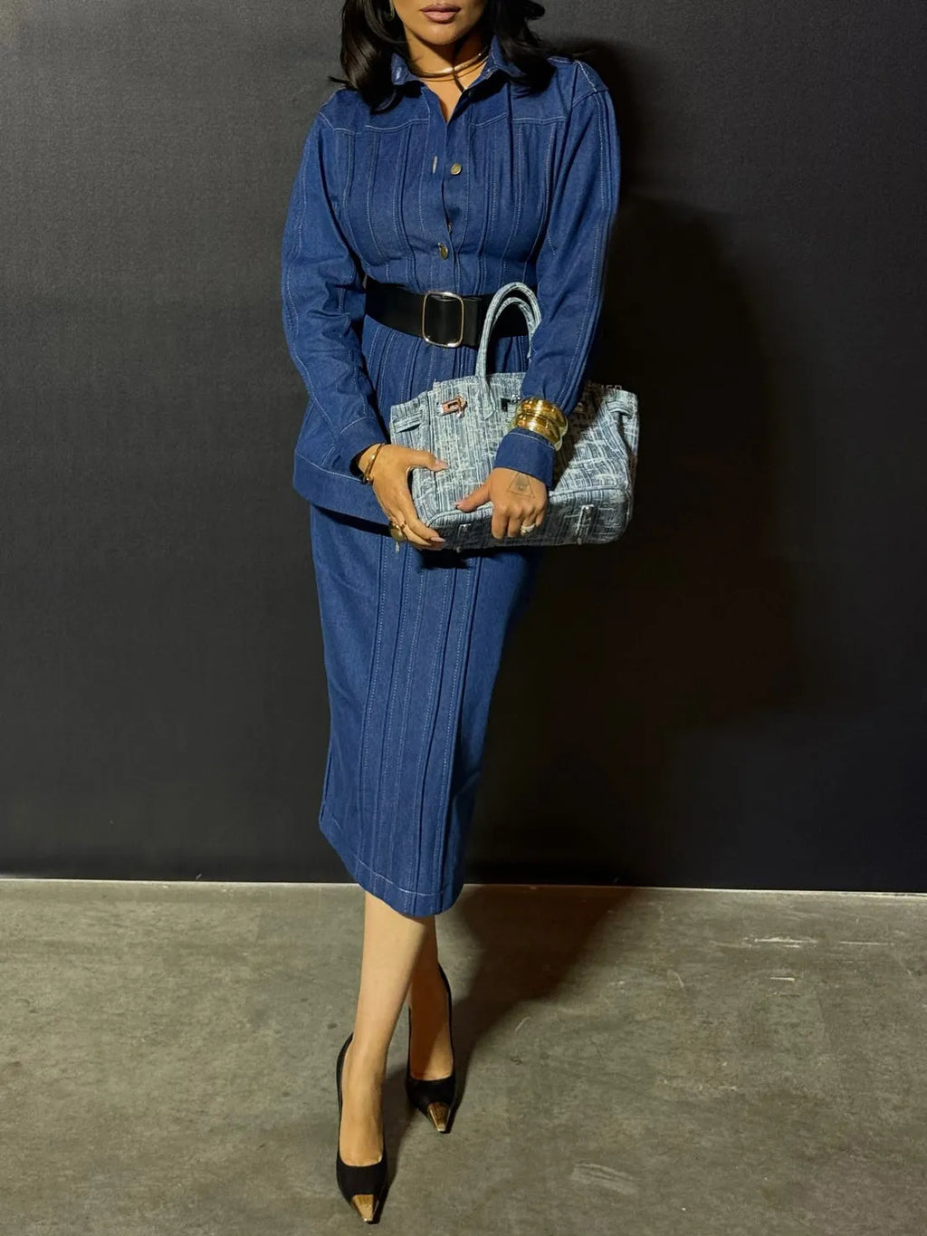 Blue denim corset-style shirt dress with patchwork design and statement buttons on a model, mini length