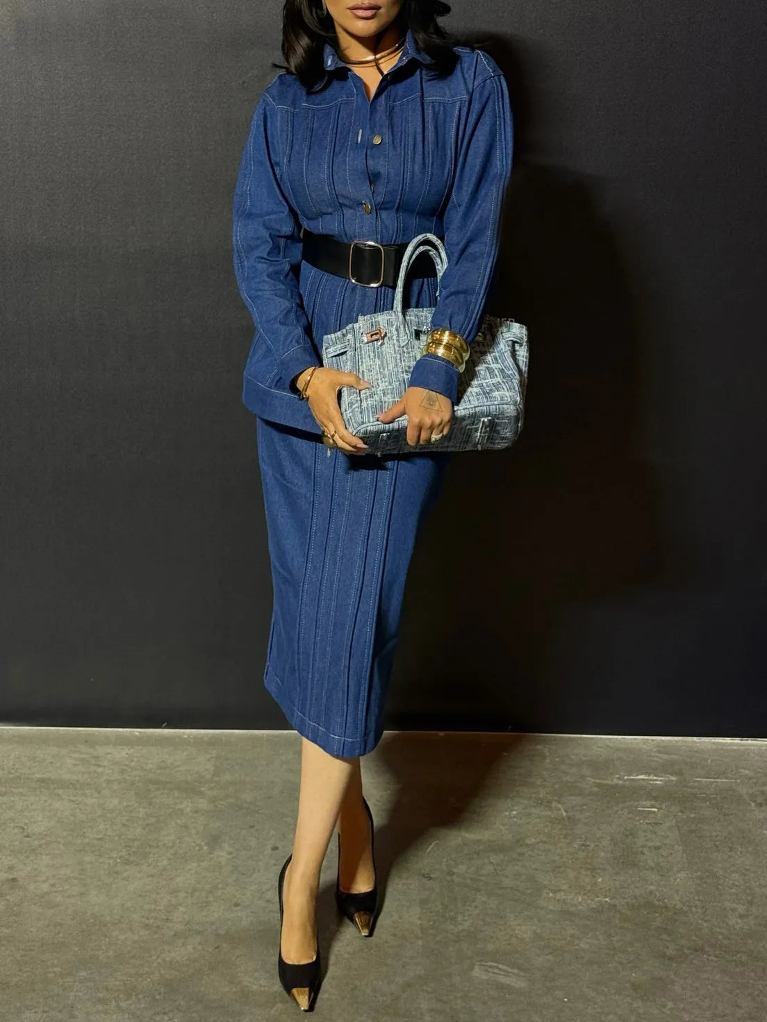Blue denim corset-style shirt dress with patchwork design and statement buttons on a model, mini length