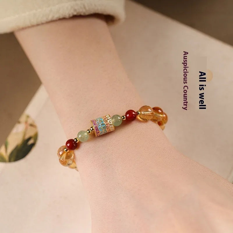 Women's citrine bracelet with 8mm prayer wheel design in yellow retro style