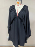 Women's apricot V-neck dress with long puff sleeves and a flounced swing skirt, mid-waist design.