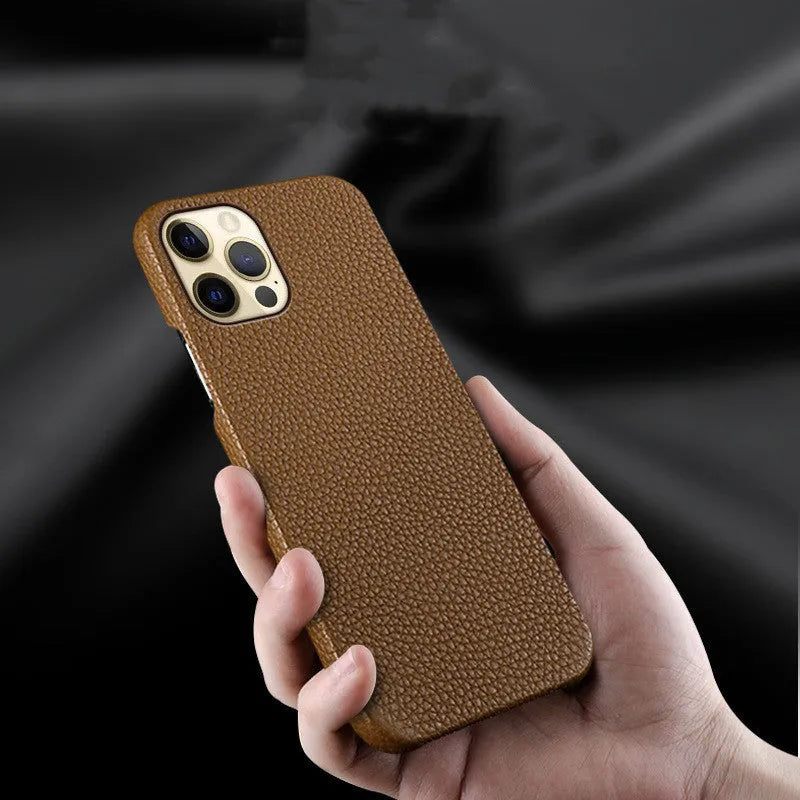 Genuine leather protective case for iPhone in simple half-wrap design on a table.