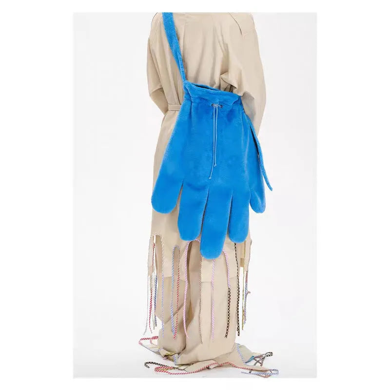Blue fur 14-inch crossbody bag with velvet lining and sewing thread details, shown on a model for scale