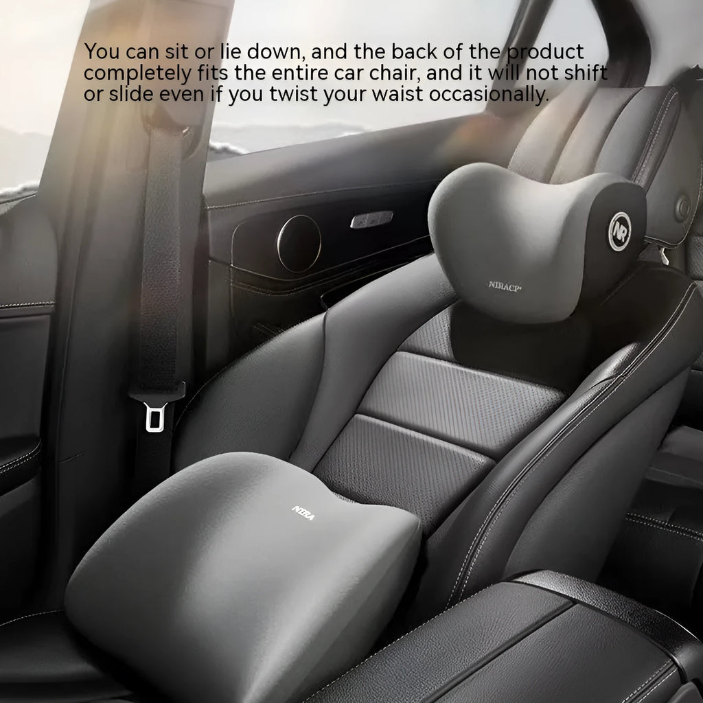 Black memory foam car headrest pillow and lumbar support pillow set on a car seat.