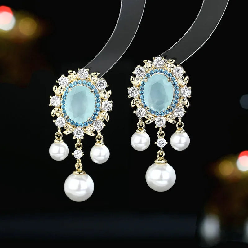 Oval geometric copper earrings with zircon inlays and pearl tassel drops in light purple colour