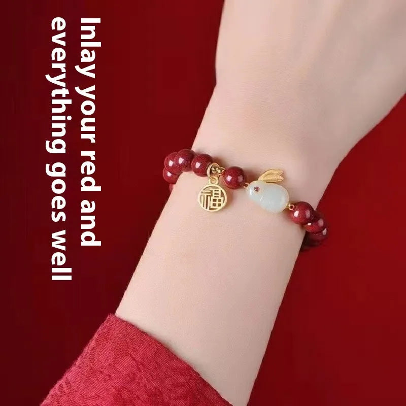 Purple gold sand cinnabar bracelet with jade hare charm in retro style.