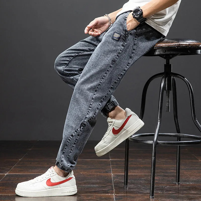 Men's loose fit cargo casual jeans in blue, showing straight leg and Korean style design.