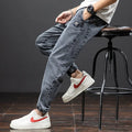 Men's loose fit cargo casual jeans in blue, showing straight leg and Korean style design.
