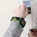 Silicone Apple Watch strap and matching protective case in black and white, two-tone design, for 44mm case size