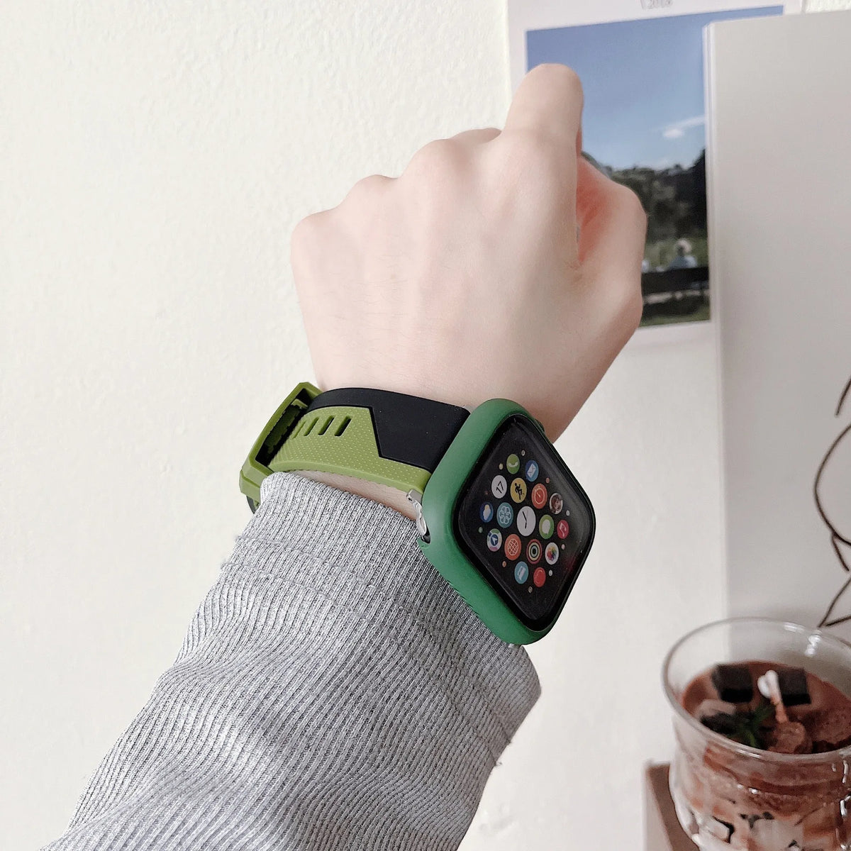 Silicone Apple Watch strap and matching protective case in black and white, two-tone design, for 44mm case size