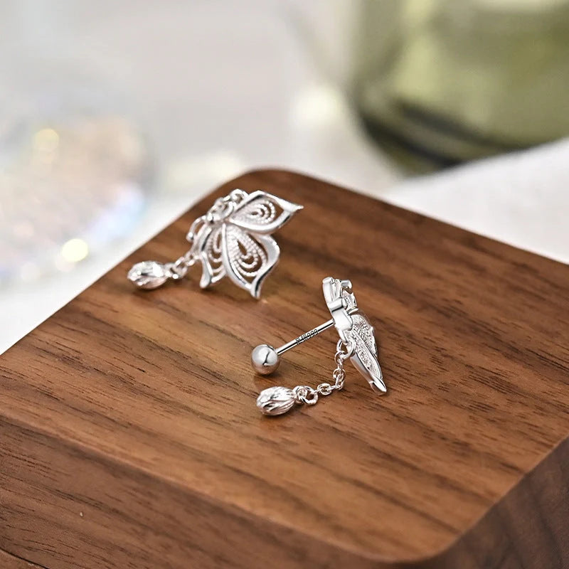 Women's S999 Sterling Silver Butterfly Tassel Earrings showcasing intricate design and shine