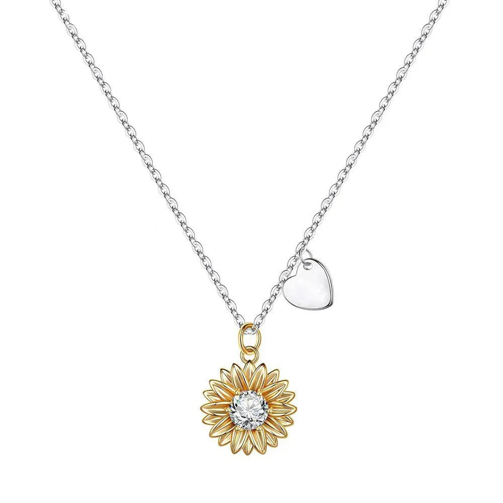 925 sterling silver sunflower necklace with daisy petal details on an adjustable cross chain.