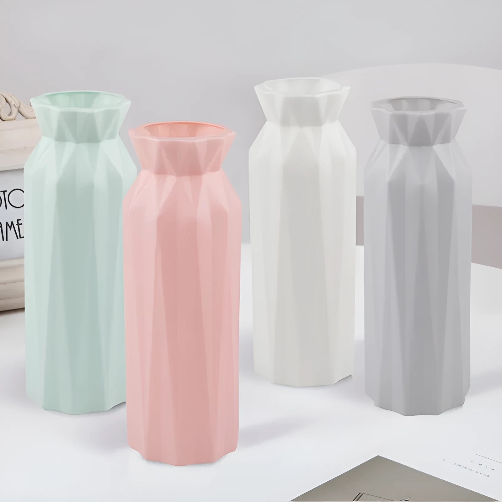 A sturdy green melamine vase with a wide 7.2cm base on a wooden surface.