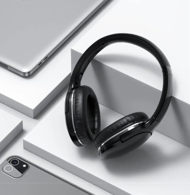 Black and white wireless Bluetooth gaming headset with sports design showing ear cushions and adjustable headband