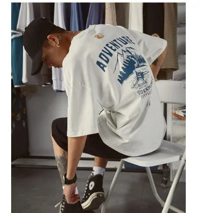 Men's loose fit plus size short-sleeved t-shirt in black, on a hanger.