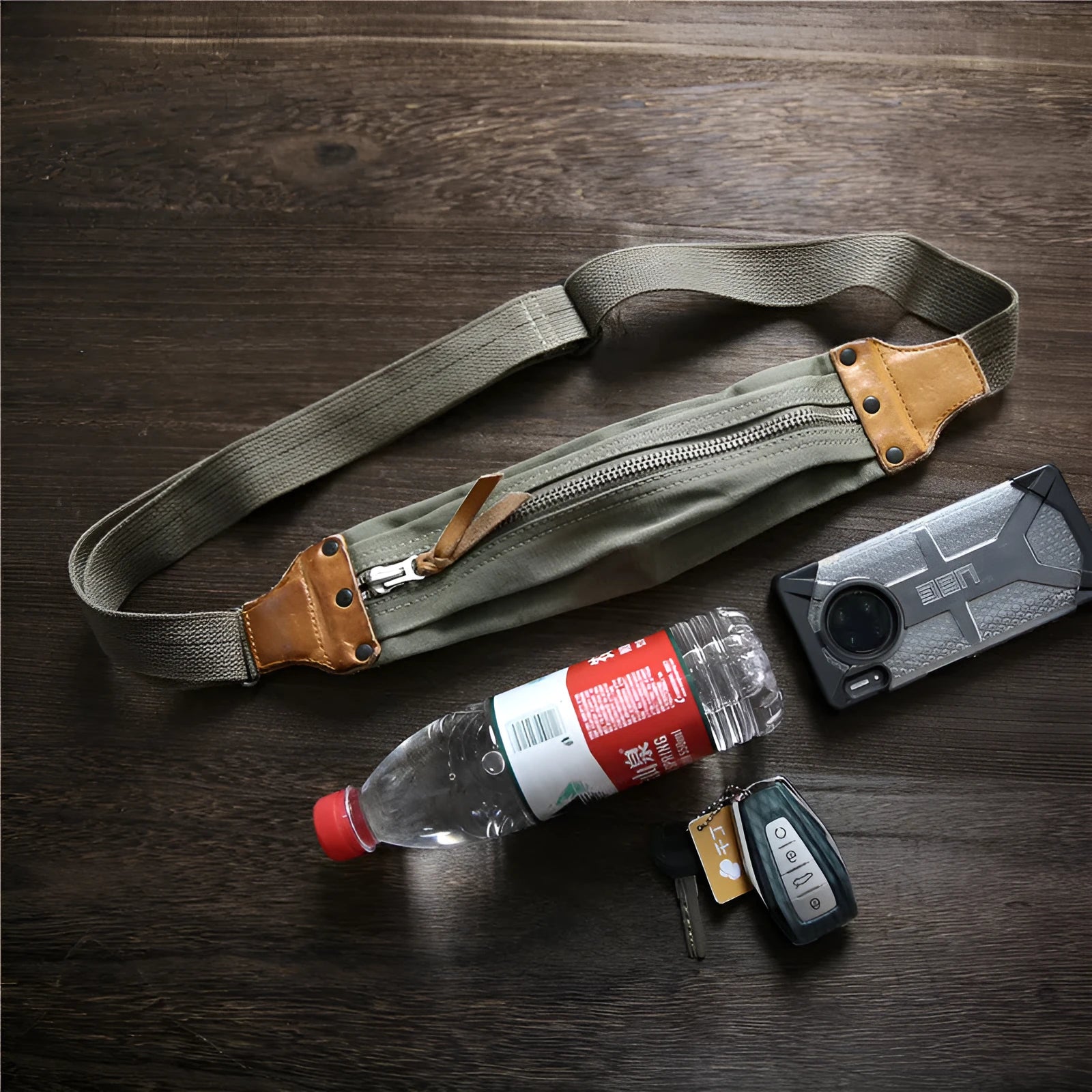 Green retro military style chest bag with washed canvas and cowhide leather detailing