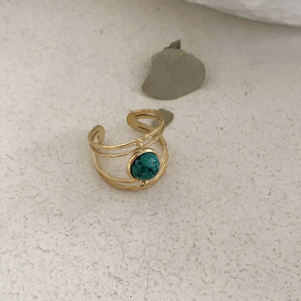 Titanium steel geometric open ring with natural green stone centrepiece on alloy band