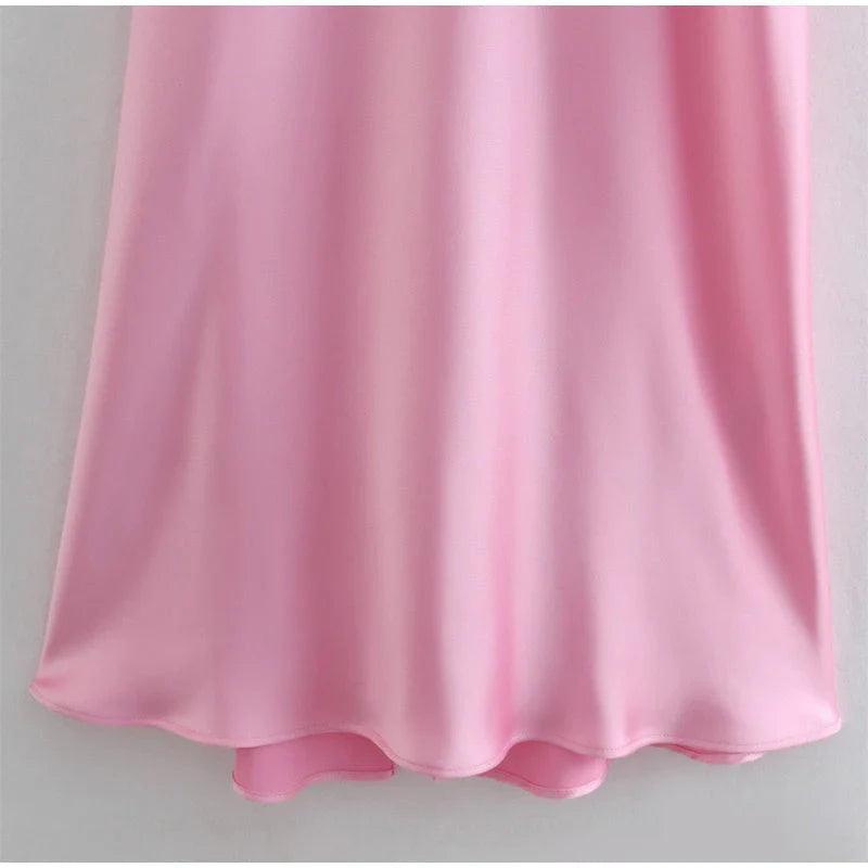 Elegant sleeveless slip maxi dress in pink with backless design and figure-flattering silhouette