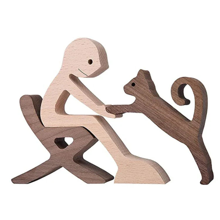 Handcrafted wooden dog sculpture featuring a man and his loyal canine companion