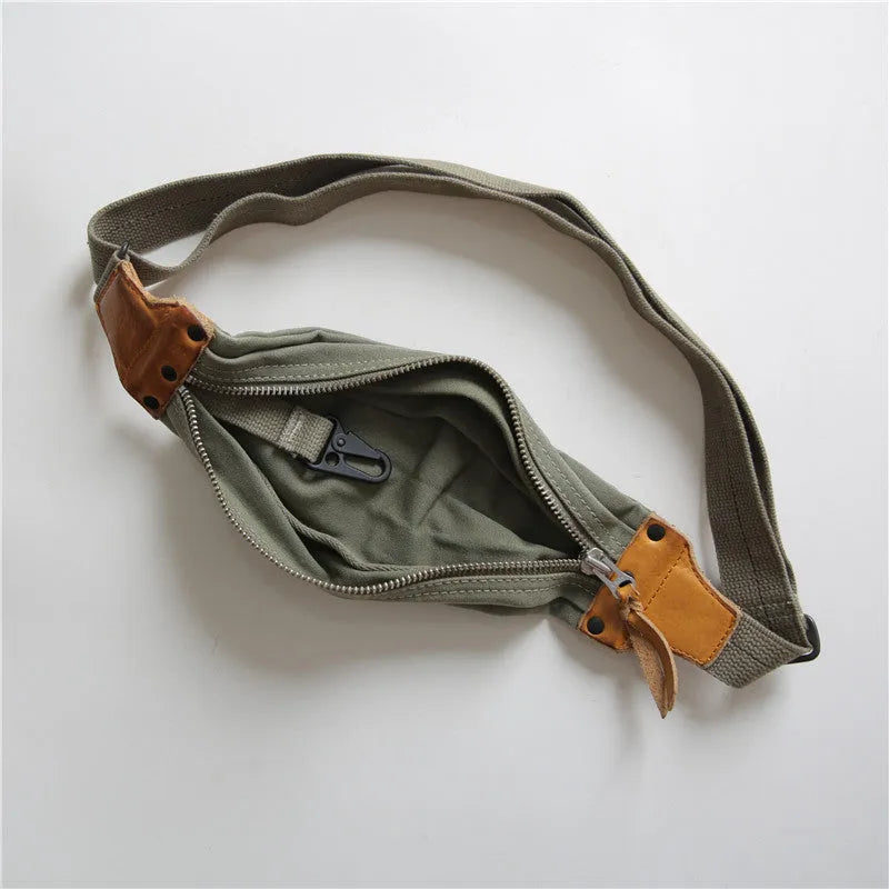 Green retro military style chest bag with washed canvas and cowhide leather detailing
