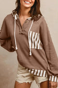 Straw yellow waffle texture hoodie with striped patchwork and a button-front drawstring neckline.