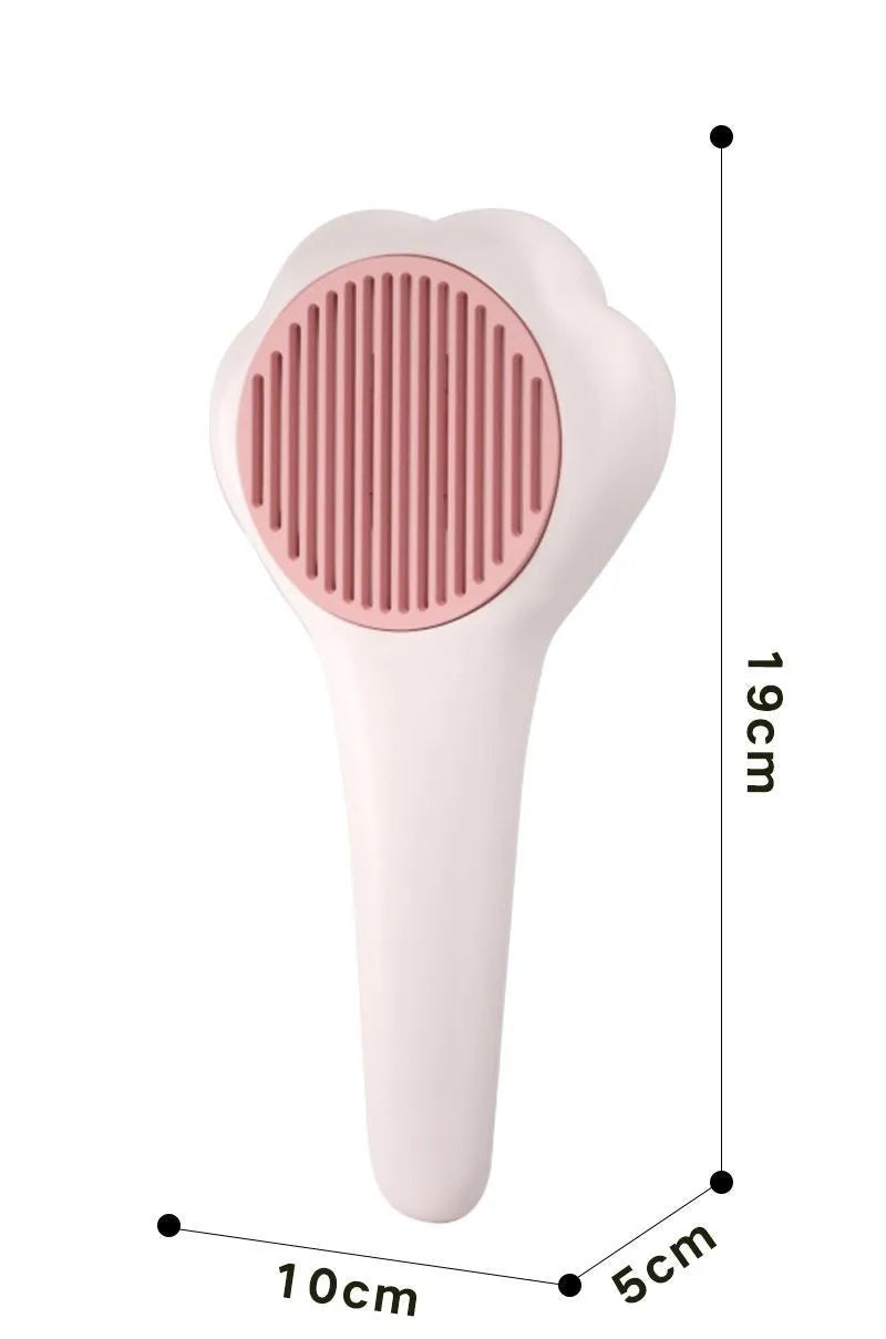 White plastic pet comb with one-click hair removal and massage feature for cat grooming