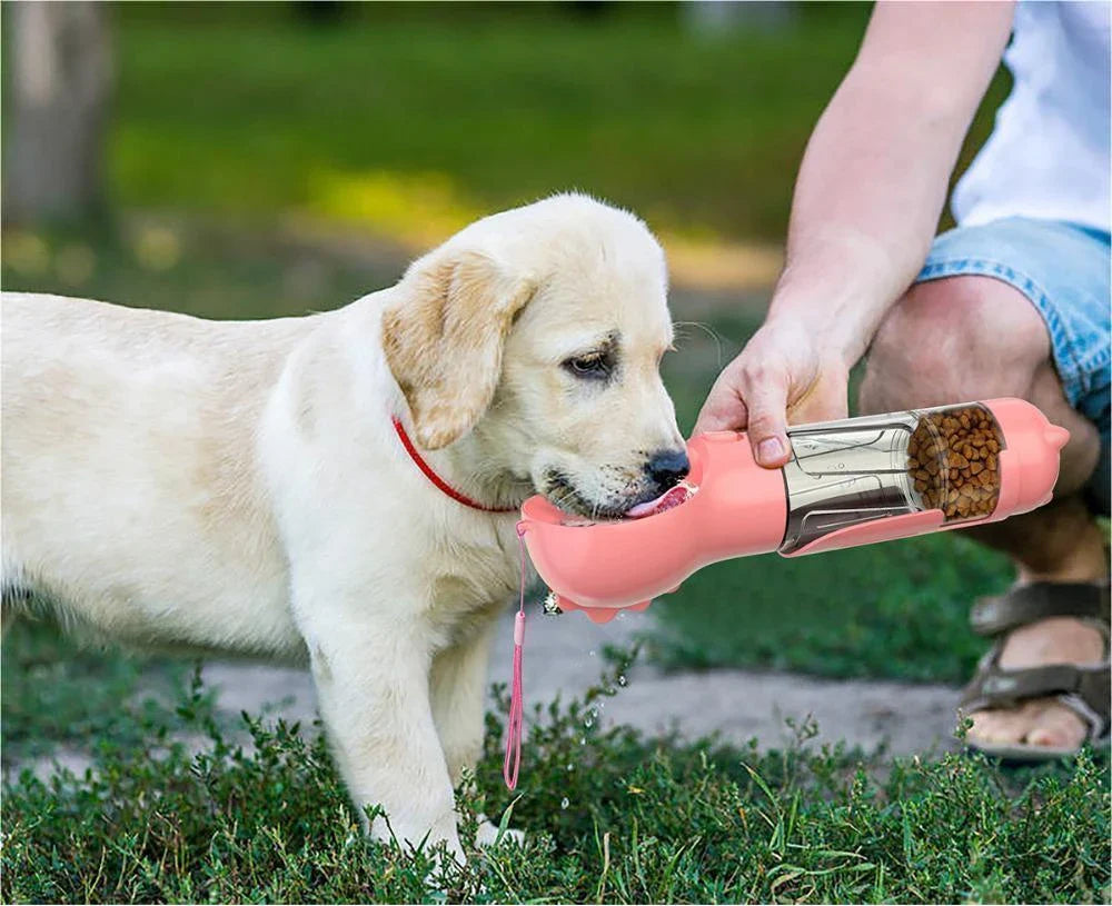 Versatile pet water bottle with integrated feeding bowl and waste bag storage compartment for on-the-go pet care