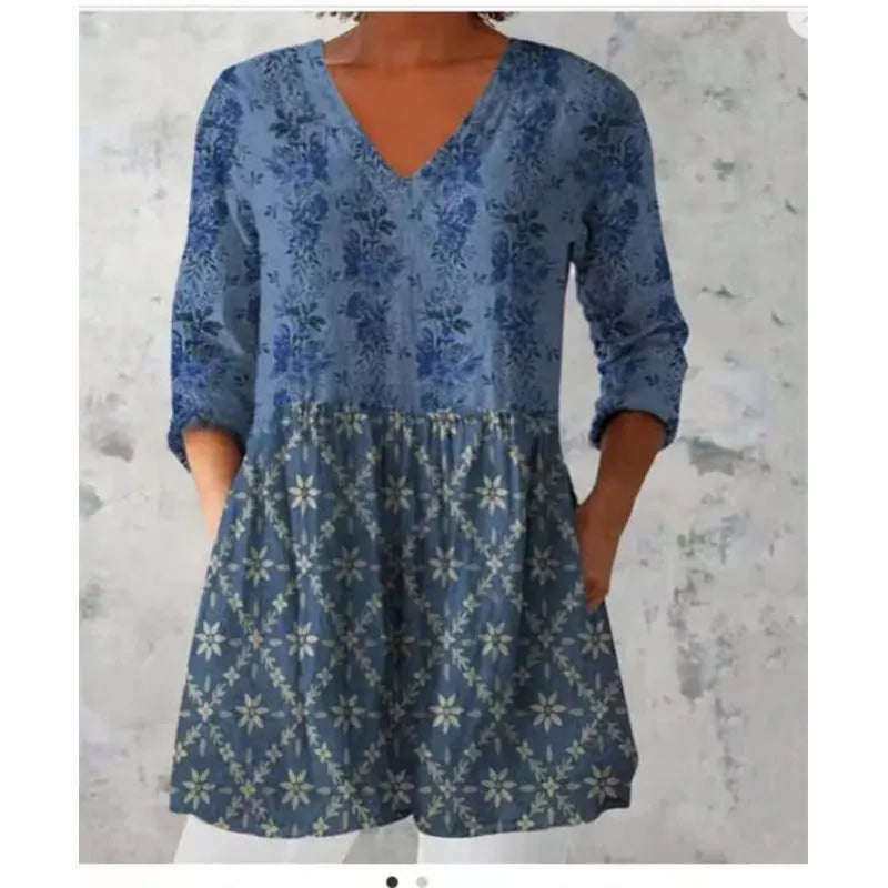 Women's printed loose-fit maxi dress with wide waist and three-quarter length sleeves.