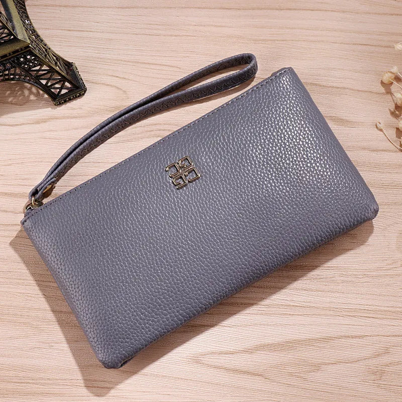 Long wine red PU leather phone wallet handbag with zip closure and sewing line detail.