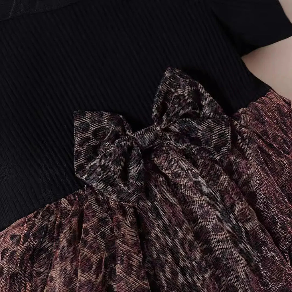 Girls cotton leopard print short sleeve pullover dress with mesh bow detail in black, front view