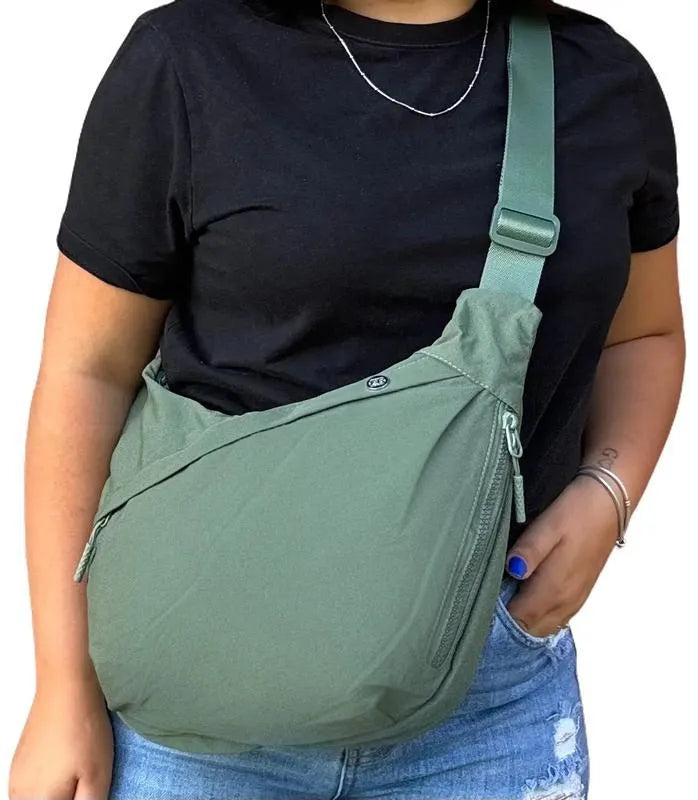 Men's PU canvas shoulder bag with adjustable strap in black, shown on a model for scale