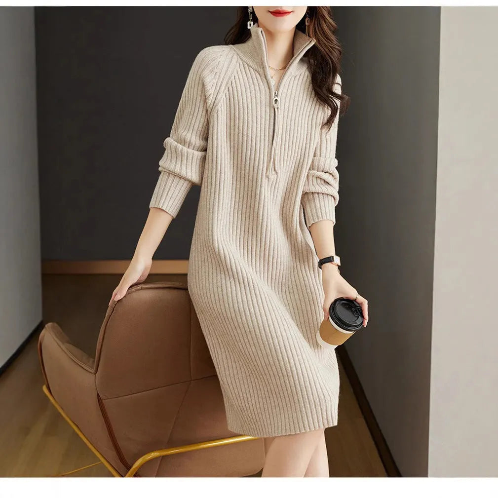 Beige half zip straight skirt with long sleeves and a stand collar, shown on a model.