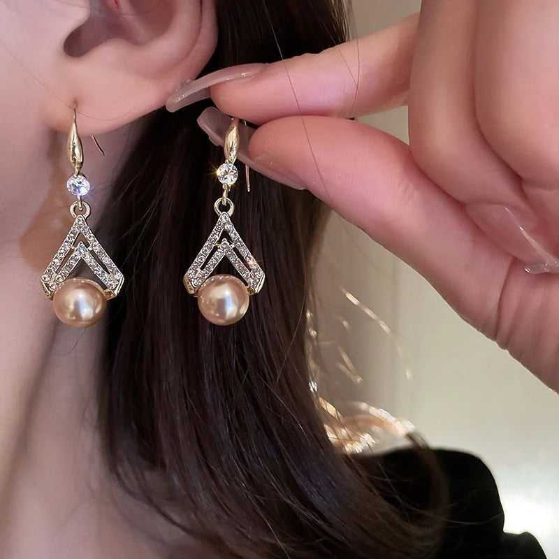 Water Drop Pearl Earrings in gold, white, and champagne with geometric design